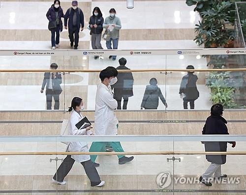 This undated file photo shows doctors walking at a hospital in Seoul. (Yonhap)