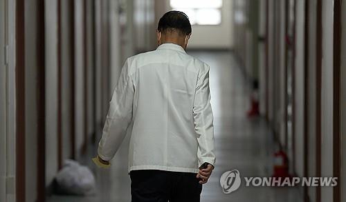 A medical professor walks down a hallway at a hospital in the southeastern city of Daegu on April 25, 2024. (Yonhap)