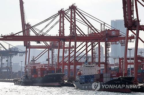 Shipping containers are stacked at a port in the southeastern city of Busan, in this file photo taken Feb. 13, 2024. (Yonhap)