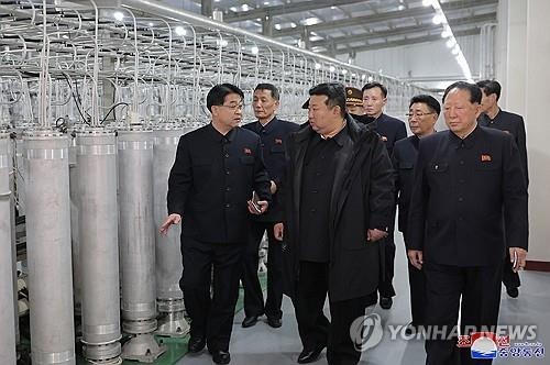 North Korean leader Kim Jong-un (C) inspects a nuclear-material production base with officials in this photo published by the Korean Central News Agency on Jan. 29, 2025. (For Use Only in the Republic of Korea. No Redistribution) (Yonhap)