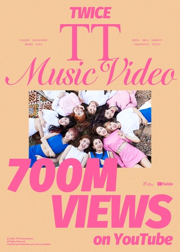 This image, provided by JYP Entertainment, celebrates the music video for K-pop girl group TWICE's 2016 hit single "TT" surpassing 700 million YouTube views. (PHOTO NOT FOR SALE) (Yonhap)