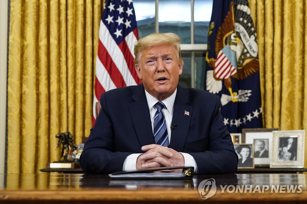 This pool photo shows U.S. President Donald Trump delivering an address to the nation on the coronavirus outbreak from the Oval Office at the White House on March, 11, 2020. (Yonhap)
