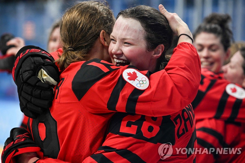 Canadian women's ice hockey team cheers