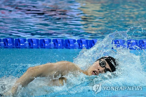 In this AFP photo, Hwang Sun-woo of South Korea competes in the heat for the men's 4x200m freestyle relay during the FINA World Championships at Duna Arena in Budapest on June 23, 2022. (Yonhap)