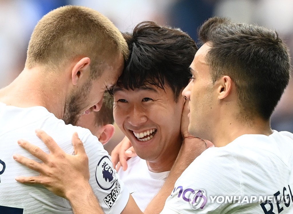 In this EPA photo, Son Heung-min of Tottenham Hotspur (C) is congratulated by teammates Eric Dier (L) and Sergio Reguilon (R) after scoring a goal against Watford during the clubs' Premier League match at Tottenham Hotspur Stadium in London on Aug. 29, 2021. (Yonhap)
