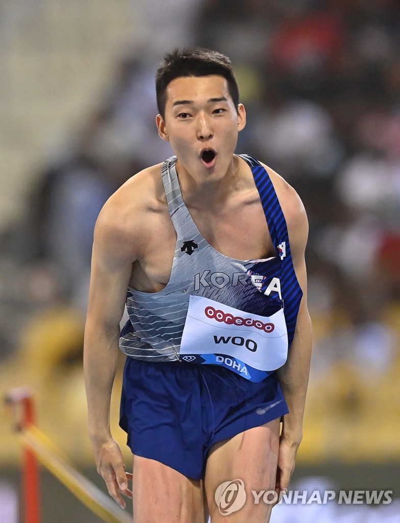 In this DPA file photo from May 13, 2022, Woo Sang-hyeok of South Korea celebrates after a successful attempt during the men's high jump event at the World Athletics Diamond League competition at Khalifa International Stadium in Doha. (Yonhap)