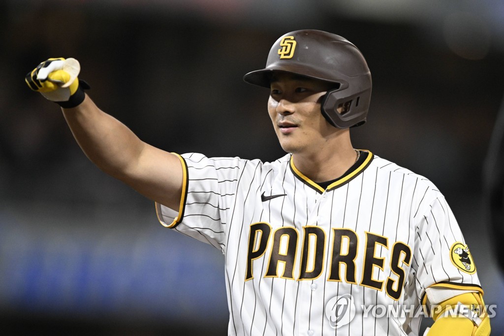In this Getty Images photo, Kim Ha-seong of the San Diego Padres celebrates his RBI single against Nick Lodolo of the Cincinnati Reds during the bottom of the fourth inning of a Major League Baseball regular season game at Petco Park in San Diego on April 18, 2022. (Yonhap)