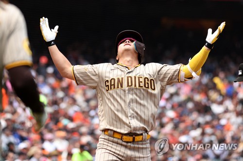 Ha-Seong Kim of the San Diego Padres is congratulated by Fernando in  2023