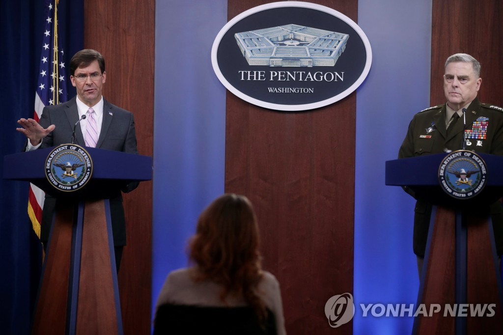 This Reuters photo shows U.S. Defense Secretary Mark Esper (L) and Joint Chiefs Chairman Army Gen. Mark Milley at a news conference at the Pentagon in Arlington, Virginia, on April 14, 2020. (Yonhap)