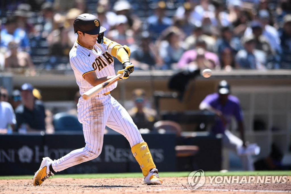 In this USA Today Sports photo via Reuters, Kim Ha-seong of the San Diego Padres hits a double against the Colorado Rockies during the bottom of the fourth inning of a Major League Baseball regular season game at Petco Park in San Diego on Aug. 3, 2022. (Yonhap)