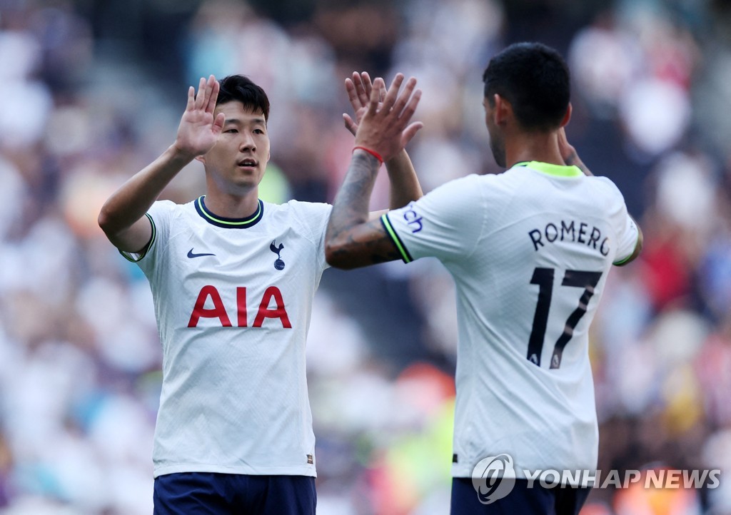 In this Action Images photo via Reuters, Son Heung-min (L) and Cristian Romero of Tottenham Hotspur celebrate their 4-1 victory over Southampton in a Premier League match at Tottenham Hotspur Stadium in London on Aug. 6, 2022. (Yonhap)