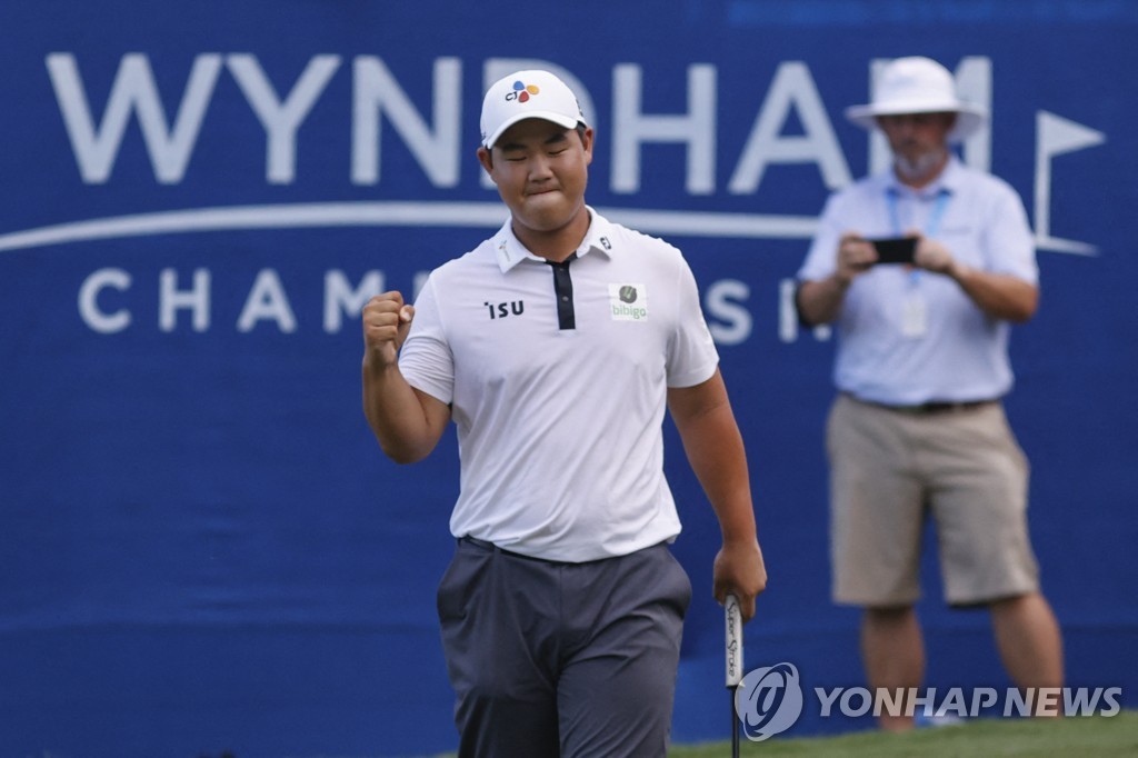 In this USA Today Sports photo via Reuters, Kim Joo-hyung of South Korea celebrates after making a par putt on the 18th green to win the Wyndham Championship at Sedgefield Country Club in Greensboro, North Carolina, on Aug. 7, 2022. (Yonhap)