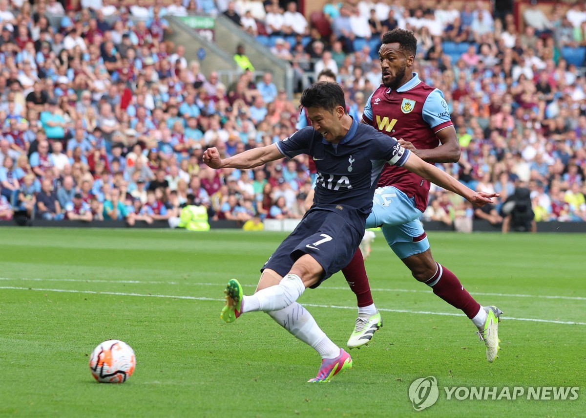 In this Reuters photo, Son Heung-min of Tottenham Hotspur (L) scores his third goal to complete a hat trick against Burnley during the clubs' Premier League match at Turf Moor in Burnley, England, on Sept. 2, 2023. (Yonhap)