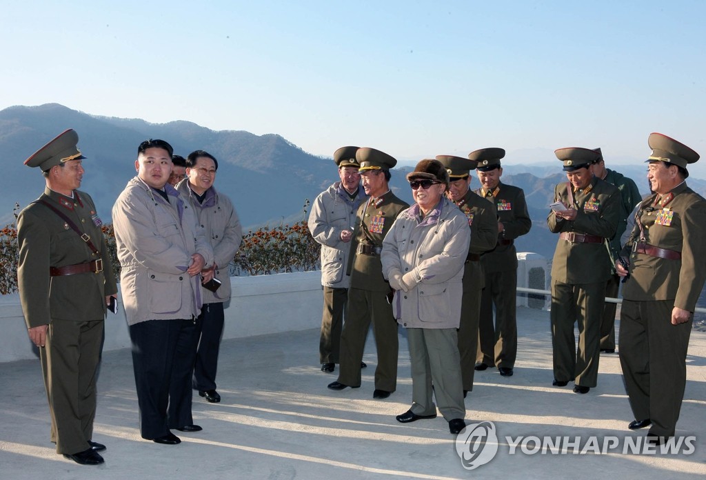 Kim Jong-un (2nd from L), then heir apparent, and his late father Kim Jong-il (C), then North Korea's leader, inspect a power plant construction site in Huichon, Jagang Province, in this undated photo released by the North's Korean Central News Agency on Nov. 4, 2010. (For Use Only in the Republic of Korea. No Redistribution) (Yonhap)