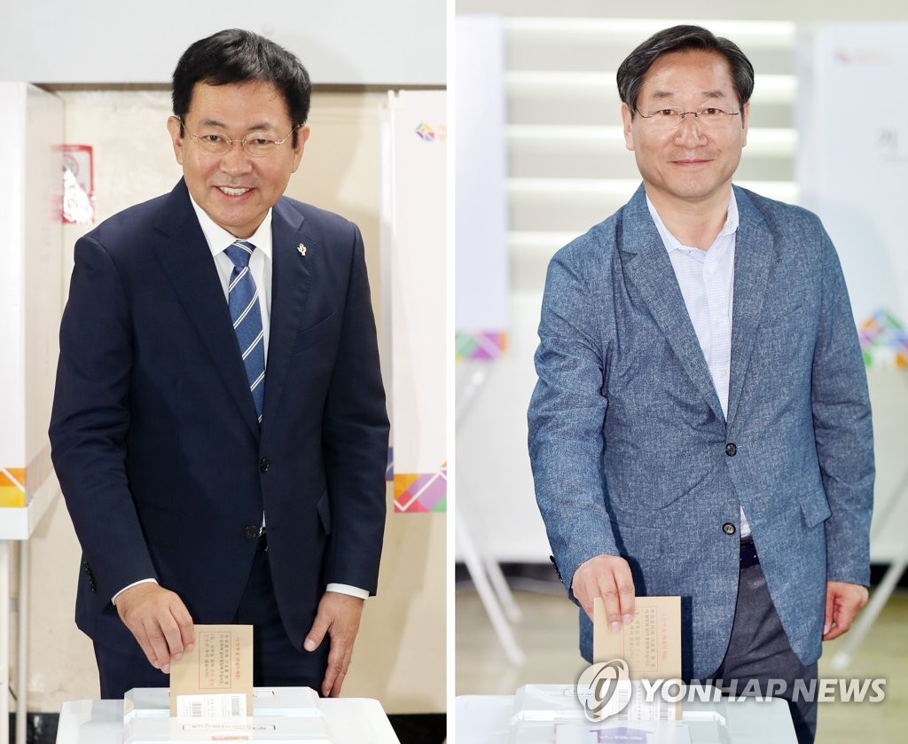 투표하는 박남춘(왼쪽)·유정복