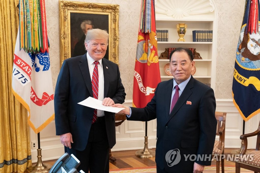 In the photo, captured from the White House Twitter account on Jan. 19, 2019, Kim Yong-chol (R), North Korea's envoy, hands a letter from his country's leader Kim Jong-un to U.S. President Donald Trump at the White House. (Yonhap)