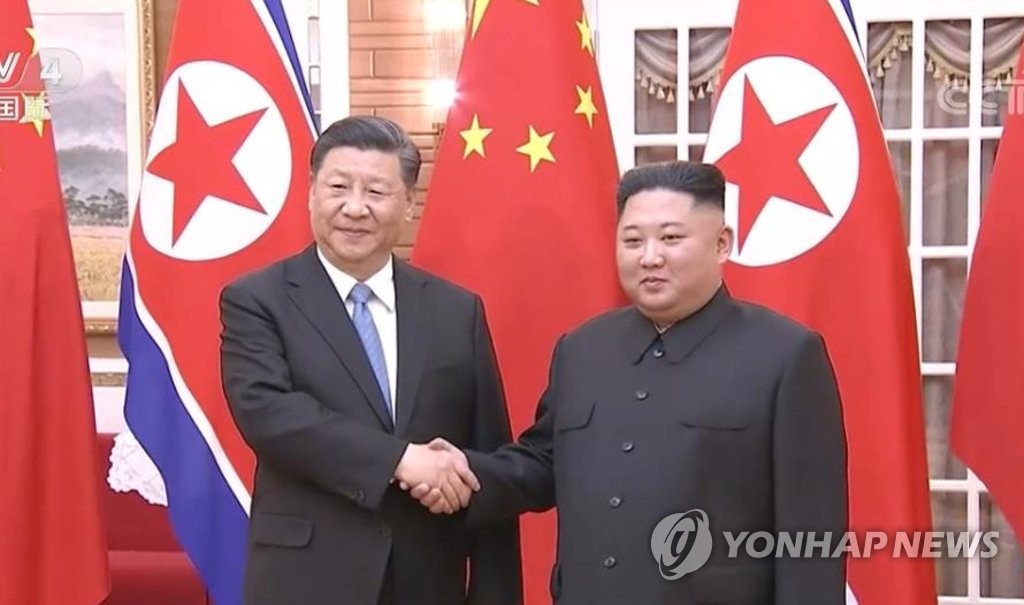 Chinese President Xi Jinping (L) shakes hands with North Korean leader Kim Jong-un prior to their summit talks in Pyongyang on June 20, 2019, in this image captured from footage of China's CCTV. (PHOTO NOT FOR SALE) (Yonhap)