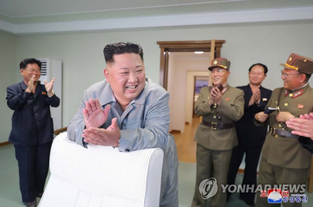 In this file photo, taken on July 25, 2019, and released by the Korean Central News Agency the following day, North Korean leader Kim Jong-un claps after watching a missile launch from a site near the North's eastern coastal town of Wonsan. (For Use Only in the Republic of Korea. No Redistribution) (Yonhap)