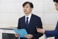 Justice Minister nominee Cho Kuk speaks to reporters at his temporary office in Seoul on Sept. 2, 2019, over his plan to hold a press conference to clarify corruption allegations involving his family. (Yonhap)