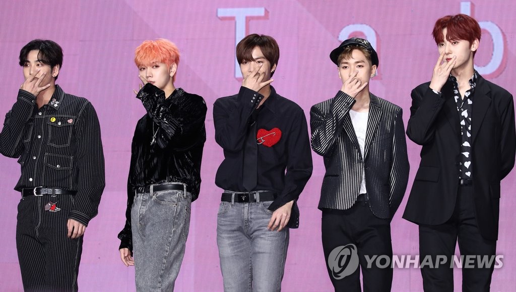 This file photo from Oct. 21, 2019, shows South Korean boy group NU'EST posing for photos during a showcase for the group's seventh EP "The Table" in Seoul. (Yonhap)