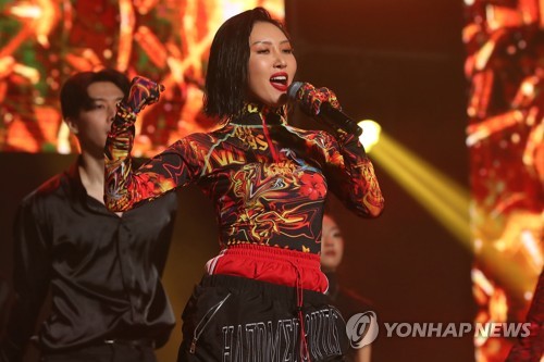 This file photo shows Hwasa, a member of South Korean girl group Mamamoo, performing during a showcase for the group's second album "reality in BLACK" in Seoul on Nov. 14, 2019. (Yonhap)
