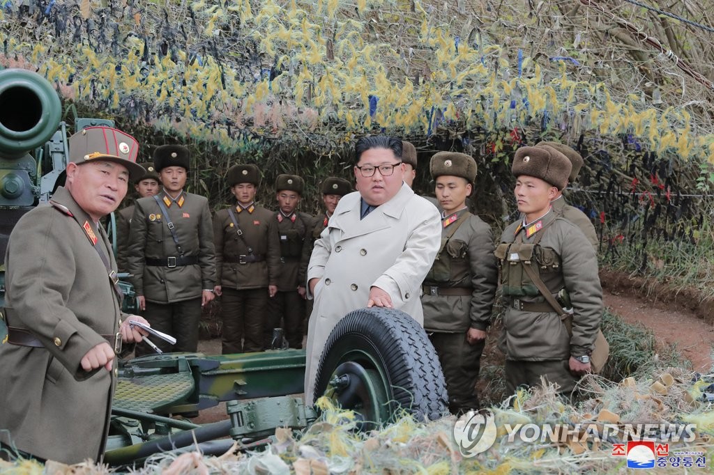 North Korean leader Kim Jong-un (C) talks with soldiers during a visit to a defense detachment on Changrin Islet near the western sea border with South Korea in this photo provided by the Korean Central News Agency on Nov. 25, 2019. The agency stopped short of reporting when he made the visit. (For Use Only in the Republic of Korea. No Redistribution) (Yonhap)