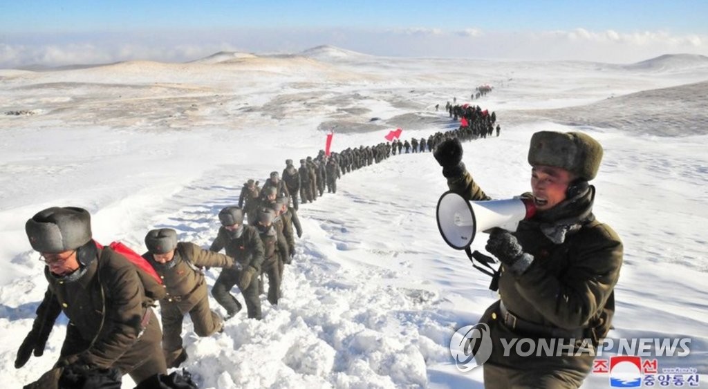 Members of a propaganda unit of North Korea's ruling Workers' Party march in a long line on a study tour of Mount. Paekdu in this photo released by the state-run Korean Central News Agency (KCNA) on Dec. 11, 2019. (For Use Only in the Republic of Korea. No Redistribution) (Yonhap)