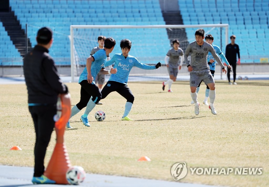 In this file photo from March 11, 2020, Daegu FC players train at Daegu Stadium in Daegu, 300 kilometers southeast of Seoul. (Yonhap)