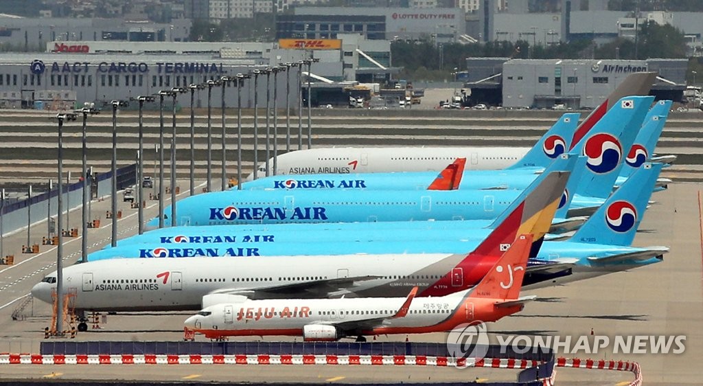 In this file photo, taken on May 7, 2020, planes are parked at Incheon International Airport, west of Seoul. (Yonhap) 
