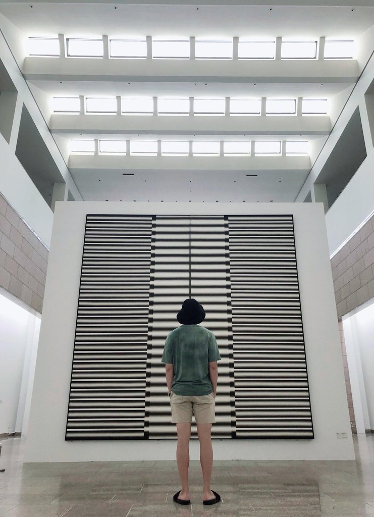 This image captured from the social media account of BTS on Aug. 9, 2020, shows group leader RM viewing a retrospective exhibit of Lee Seung-jio at the National Museum of Modern and Contemporary Art's gallery in Gwacheon, south of Seoul. (PHOTO NOT FOR SALE) (Yonhap)