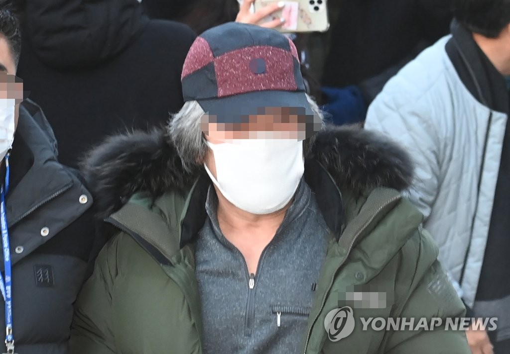 Cho Doo-soon, one of the country's most notorious child rapists in recent memory, arrives at a probation center in Ansan, south of Seoul, on Dec. 12, 2020, after being released from prison earlier in the day. (Yonhap)