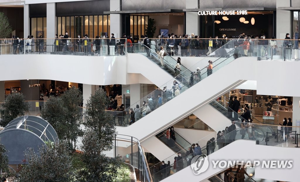 This photo, taken on Feb. 26, 2021, shows people looking around The Hyundai Seoul, a newly opened department store in western Seoul. (Yonhap)