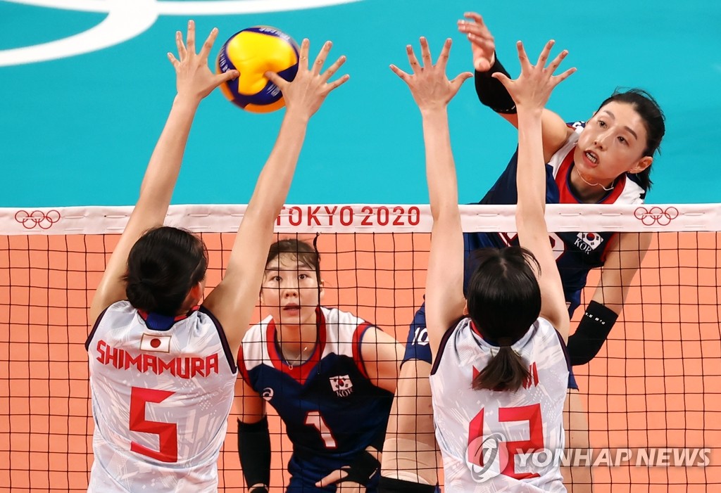 South Korean outside attacker Kim Yeon-koung (R) spikes in the Pool A match against Japan in women's volleyball at the Tokyo Olympics at Ariake Arena in Tokyo on July 31, 2021. (Yonhap)