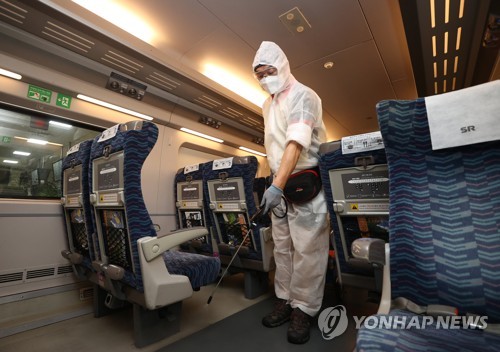A health worker disinfects a cabin of a train at Suseo Station in Seoul on Sept. 15, 2021. (Yonhap)