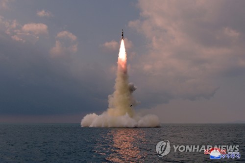 In this photo released Oct. 20, 2021, by North Korea's official Korean Central News Agency, a new type of a submarine-launched ballistic missile (SLBM) is test-fired from waters the previous day. (For Use Only in the Republic of Korea. No Redistribution) (Yonhap)