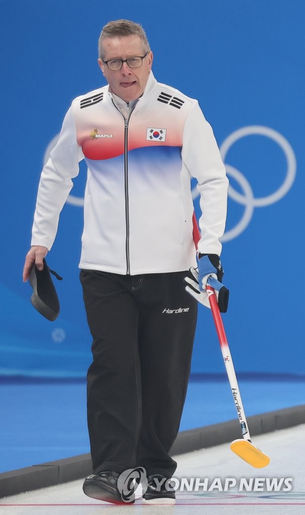 Peter Gallant, coach of the South Korean women's curling team, watches his athletes during a training session at the National Aquatics Centre in Beijing on Feb. 9, 2022. (Yonhap)