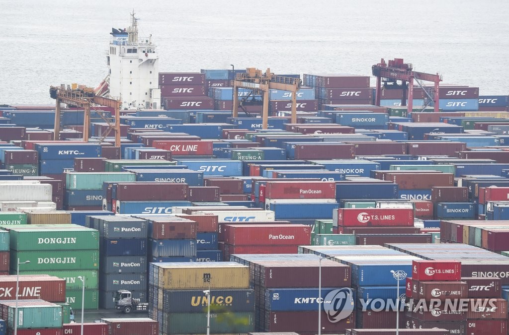 This file photo, taken April 21, 2022, shows stacks of containers at a port in South Korea's southeastern city of Busan. (Yonhap)