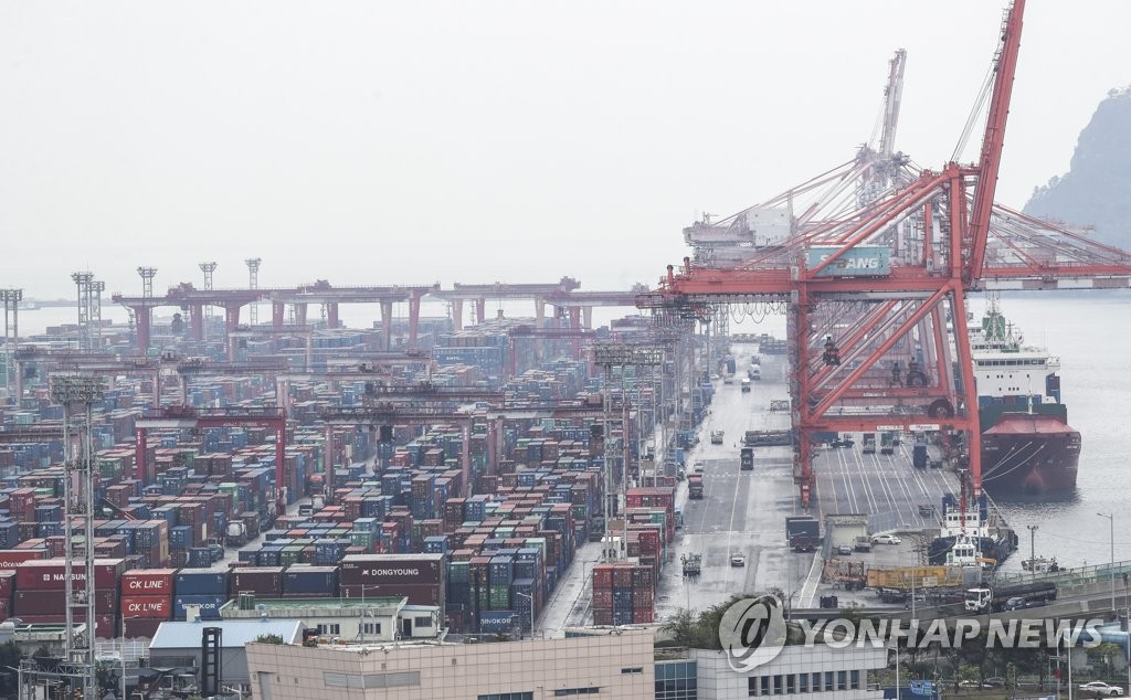 This file photo, taken April 1, 2022, shows stacks of containers at a port in South Korea's southeastern city of Busan. (Yonhap)