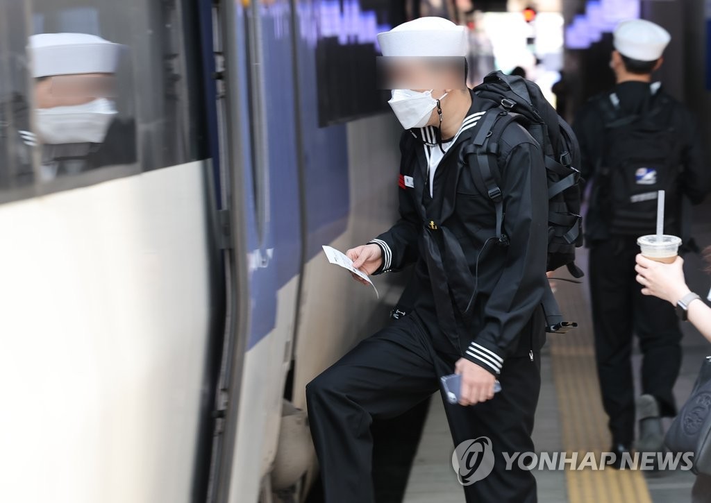 In this file photo, a service member boards a train at Seoul Station in central Seoul on May 1, 2022. (Yonhap)
