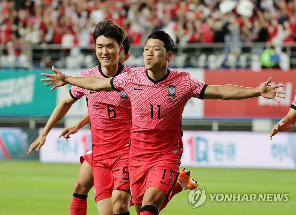 In this file photo from June 6, 2022, Hwang Hee-chan of South Korea (R) celebrates after scoring a goal against Chile during the countries' friendly football match at Daejeon World Cup Stadium in Daejeon, 160 kilometers south of Seoul. (Yonhap)