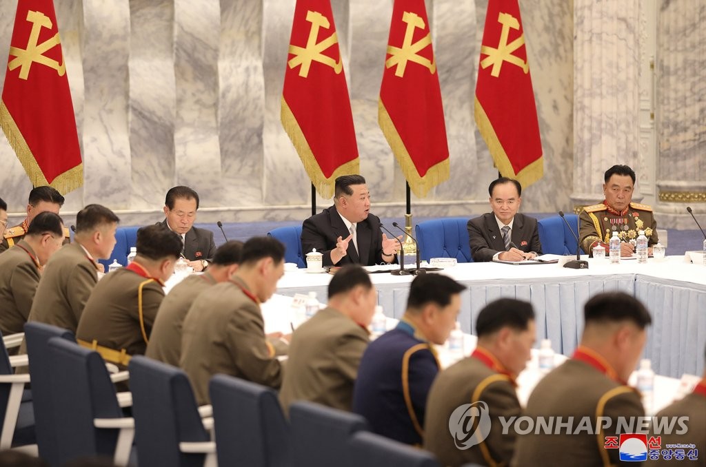 North Korean leader Kim Jong-un (C) speaks during a meeting of the central military commission of the Workers' Party in Pyongyang on June 21, 2022, to discuss major tasks to build up national defense and implement key defense policies. (For Use Only in the Republic of Korea. No Redistribution) (Yonhap)