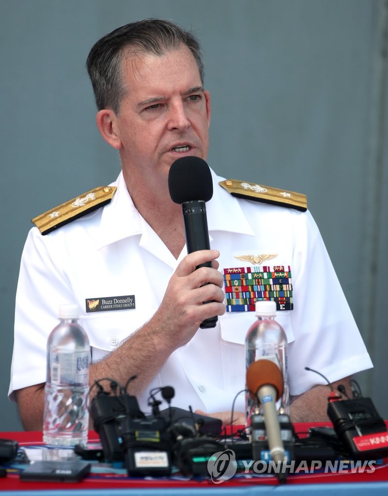Rear Adm. Michael Donnelly, commander of the U.S. Navy's Carrier Strike Group Five, speaks during a meeting with reporters aboard the USS Ronald Reagan aircraft carrier in South Korea's southeastern city of Busan on Sept. 23, 2022. (Pool photo) (Yonhap) 