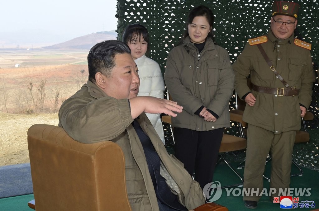 North Korean leader Kim Jong-un (L) inspects the test-firing of a Hwasong-17 intercontinental ballistic missile (ICBM) at Pyongyang International Airport, in this photo released by the country's state media. (For Use Only in the Republic of Korea. No Redistribution) (Yonhap)