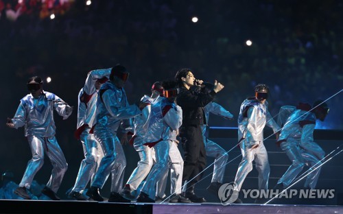 BTS member Jungkook (C) performs during the opening ceremony for the 2022 FIFA World Cup at Al Bayt Stadium in Al Khor, north of Doha, on Nov. 20, 2022. (Yonhap)