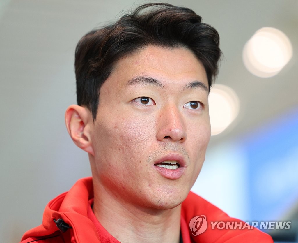 FC Seoul forward Hwang Ui-jo speaks to reporters at Incheon International Airport, west of Seoul, before departing for Kagoshima, Japan, for training camp on Feb. 6, 2023. (Yonhap)