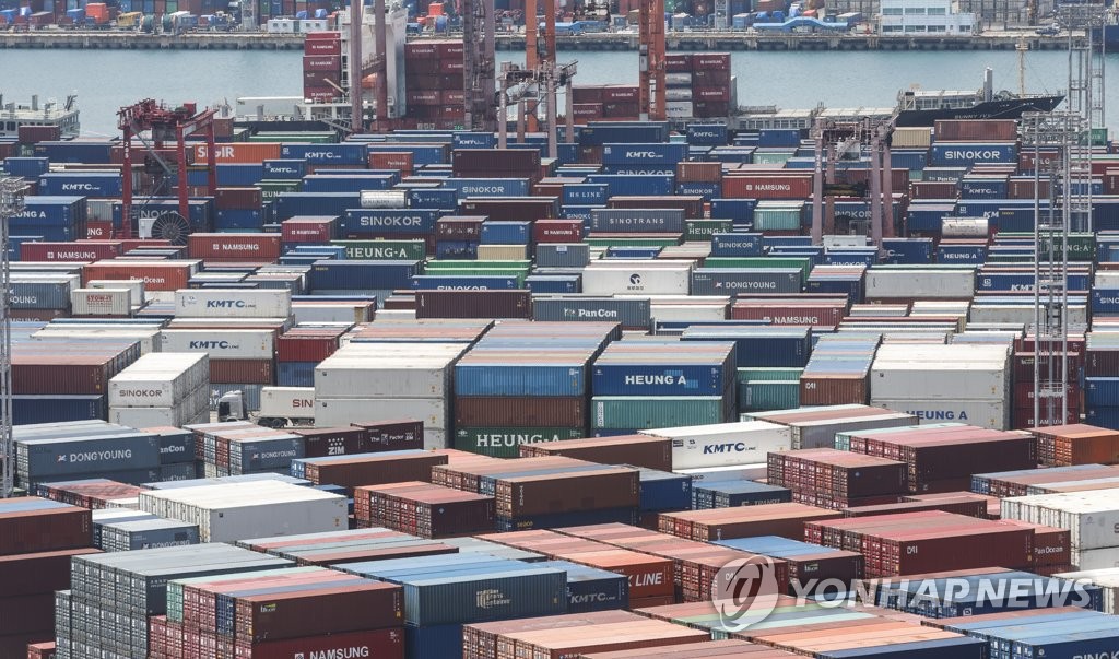 Containers for export are stacked at a pier in South Korea's largest port city of Busan on May 10, 2023. (Yonhap)