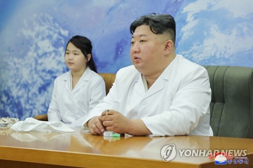 N. Korean leader inspects military spy satellite: state media