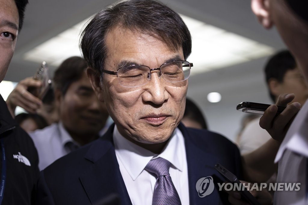 National Election Commission Chairperson Rho Tae-ak leaves the agency office in Gwacheon, south of Seoul, on June 9, 2023, after a meeting of commissioners over whether to accept the Board of Audit and Inspection's inspection into a hiring corruption scandal involving high-ranking officials. (Yonhap)