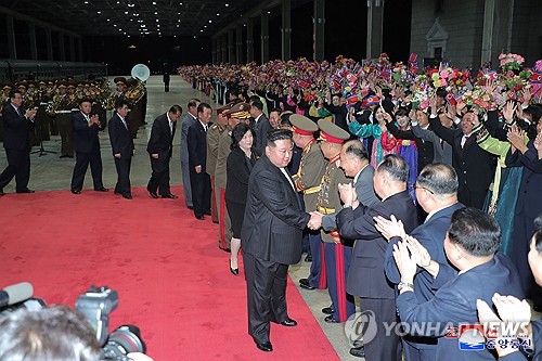 This photo, carried by North Korea's official Korean Central News Agency on Sept. 20, 2023, shows the North's leader Kim Jong-un (C) welcomed by a cheering crowd and top officials at Pyongyang Railway Station after a special train carrying him arrived in Pyongyang the previous day after a trip to Russia. (For Use Only in the Republic of Korea. No Redistribution) (Yonhap)