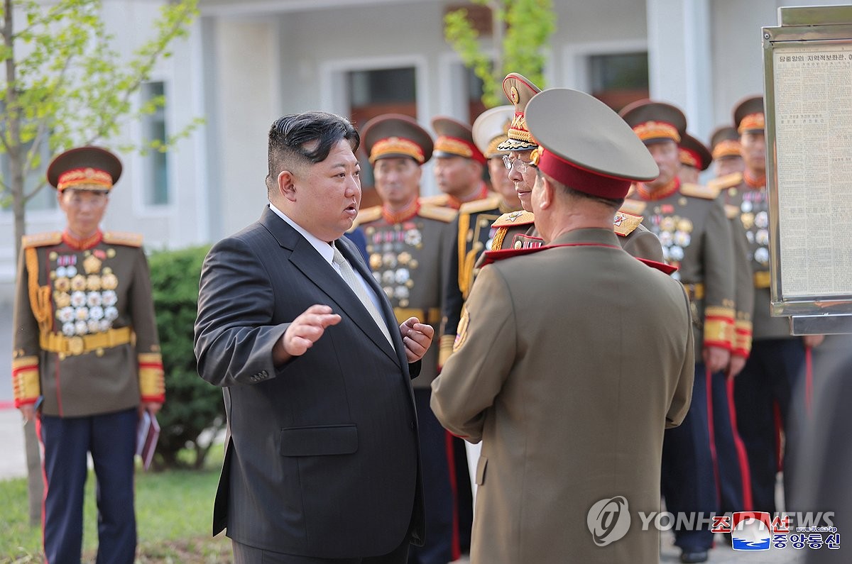 This photo, carried by North Korea's official Korean Central News Agency on April 26, 2024, shows the North's leader Kim Jong-un (front, L) visiting Kim Il Sung Military University the previous day to mark the 92nd founding anniversary of the Korean People's Revolutionary Army. (For Use Only in the Republic of Korea. No Redistribution) (Yonhap)